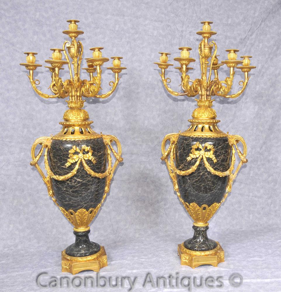 Photo: Pair French Empire ormolu candelabras sprouting out of the marble urns
