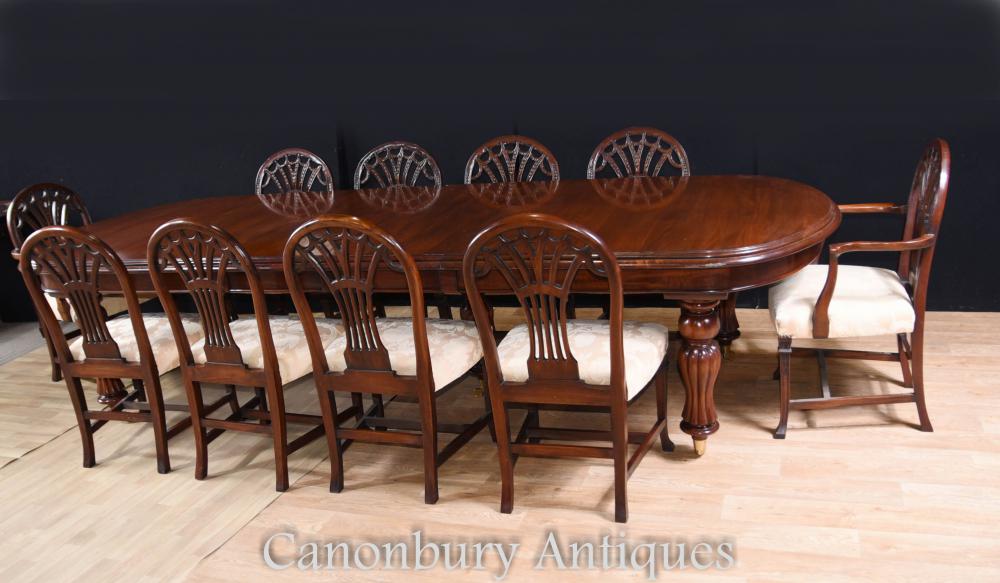 Victorian dining table with set of Hepplewhite chairs around matching in mahogany