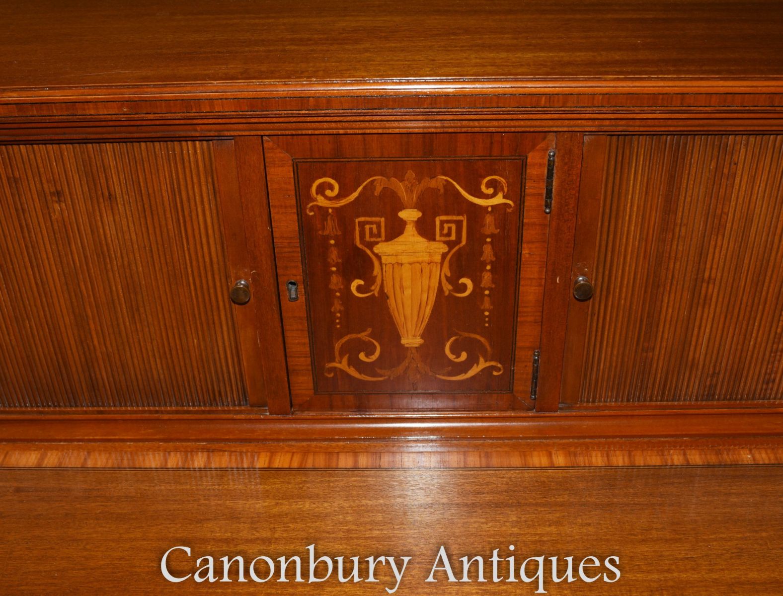 Classic urn motif on this piece of Sheraton Revival furniture