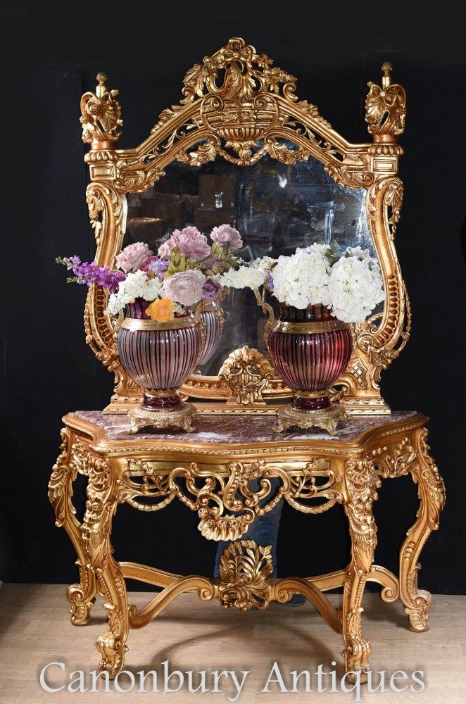 Vases reflected in the glass of the gilt console table
