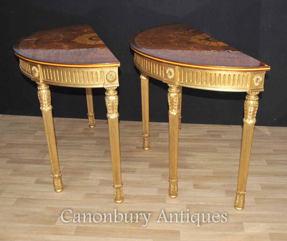 Painted gold leaf bases on this pair of half round hall tables