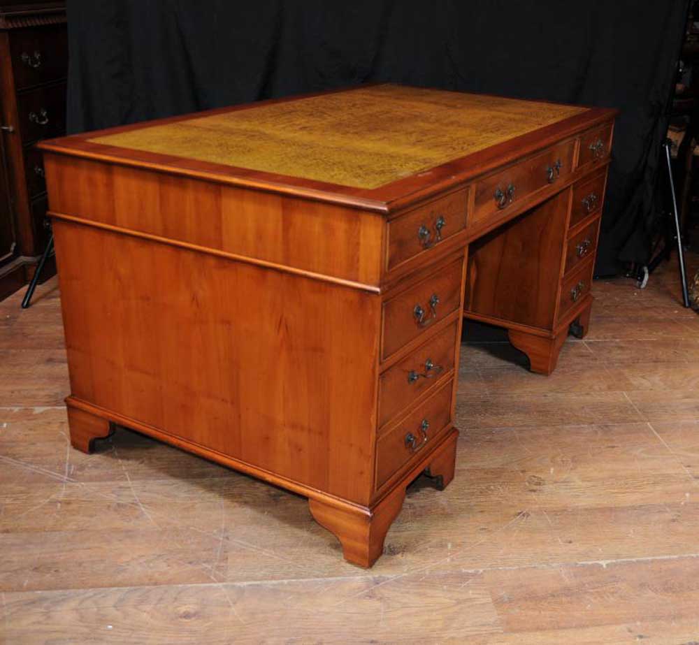 This antique pedestal desk is in yew wood