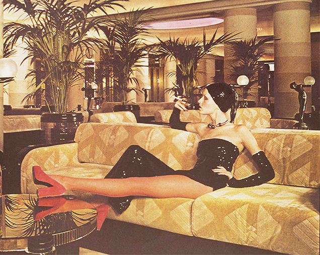 Twiggy smokes on the sofa - 1960s flapper