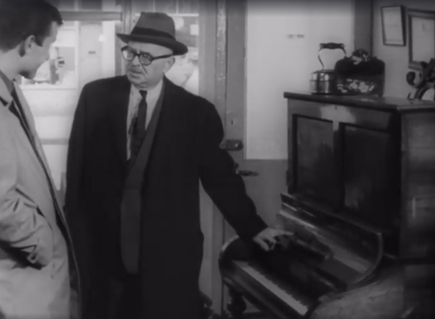 Fancy a piano? 1963 footage of George Knapp inside 174 Westbourne Grove, W11 prior to selling the showroom to Canonbury Antiques