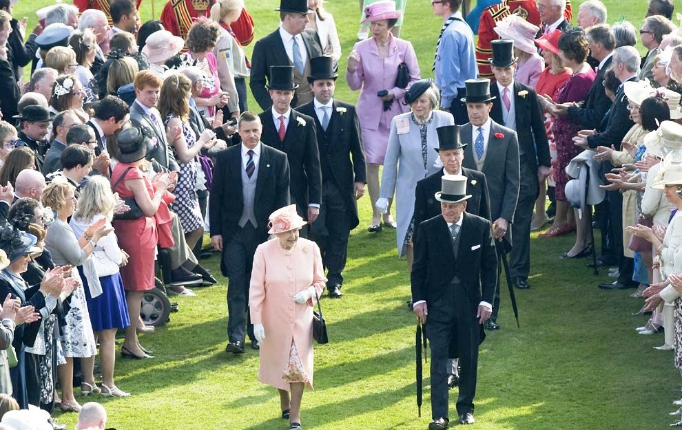 The Queen strolls on the lawn at a Buckingham Palace Garden Party